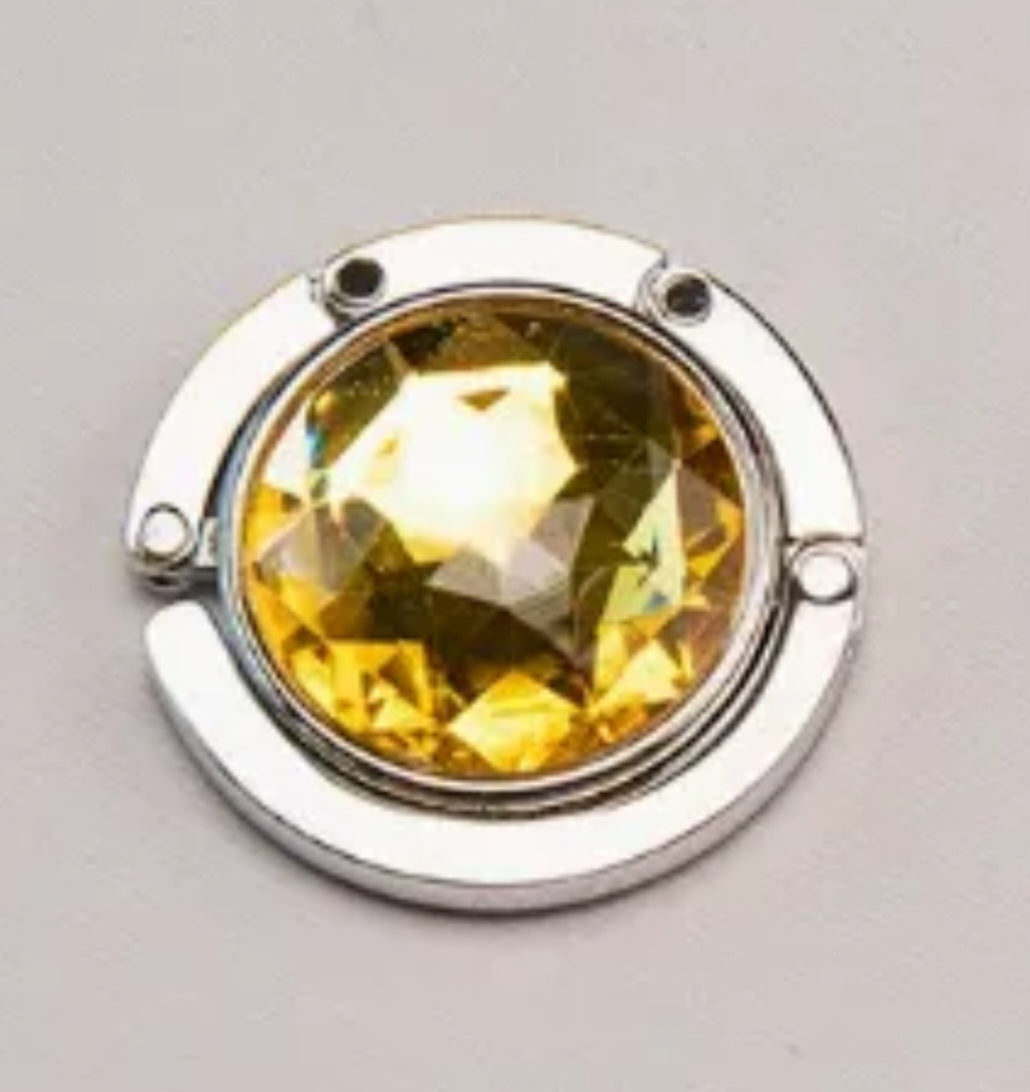 Circular-shaped Yellow-colored stone bag hook