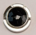 Circular-shaped Black-colored stone bag hook