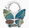 Multi-plotted brown-blue butterfly-shaped hook